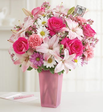 pink flowers in clear glass vase