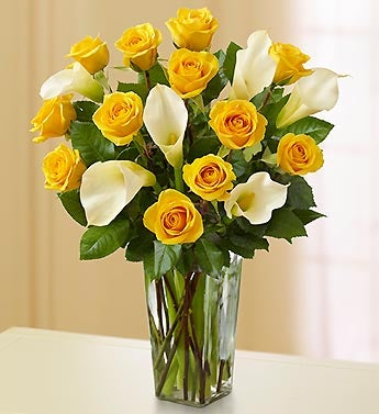 white and yellow rose bouquets. yellow rose and white calla